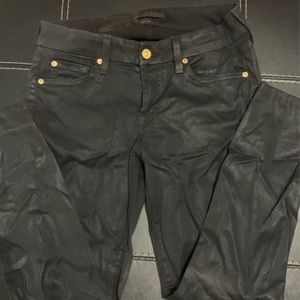 Shiny black pants with gold accents